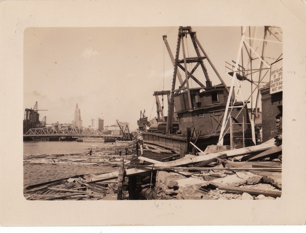 General destruction in the upper harbor, Providence, RI. Workboat floated up on land by storm surge. New England Hurricane of 1938.